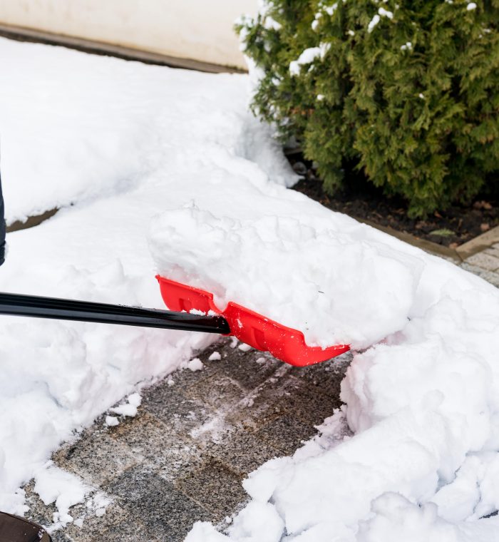 close-up-of-man-clearing-snow-and-ice-from-the-sid-2024-12-02-00-26-36-utc-min