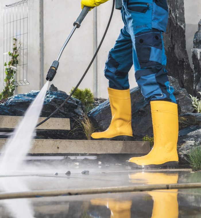 men-pressure-washing-his-garden-architectural-conc-2025-03-13-12-13-33-utc-min